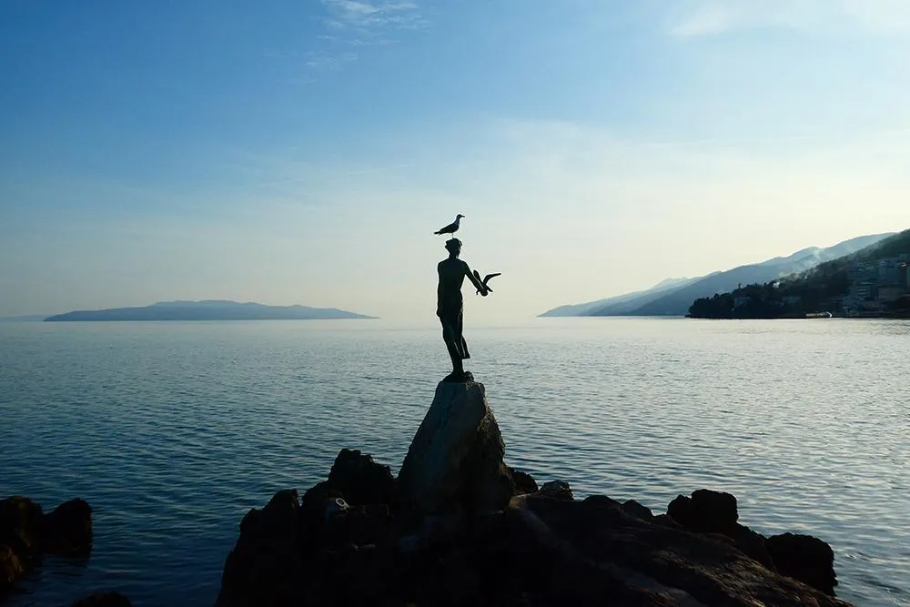A Seagull Lands on the Maiden with the Seagull in Opatija, Croatia taken by Mike Vuolo
